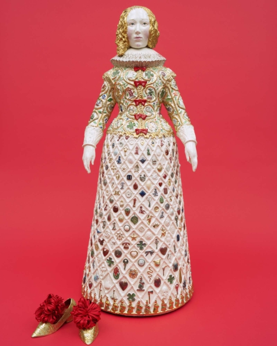 Claire Partington, Lady Luck, 2021, Ceramic and mixed media + brass shoes, 32" x 12.5" x 12.5"