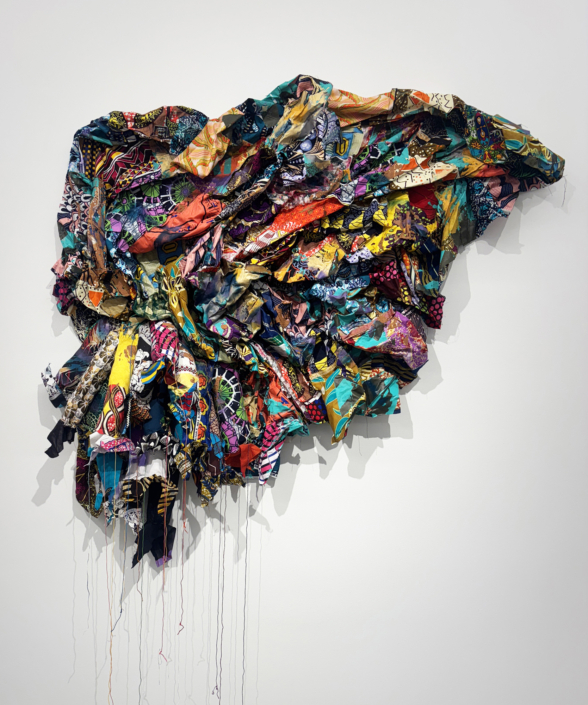 Jamele Wright Sr., Levitate 17, 2025, Mixed media; Georgia red clay, dutch wax cloth, 51″ x 56″ x 8″