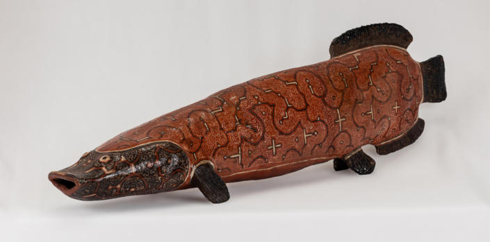 Celia Vásquez Yui, Old Paiche (Amazon River fish, AKA Arapaima or Pirarucu), Red, 2017, Coil-built pre-fire slip-painted clay and vegetal resins, 9.25″ x 5.75″ x 29″