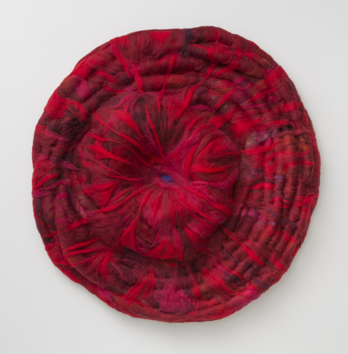 Daniela Gomez Paz, Centro en quemas, Red’s center, 2025, Coiled yarn, roving wool, felted wool, found objects, and hand-embroidered cloth, 48″ x 43″ x 9″